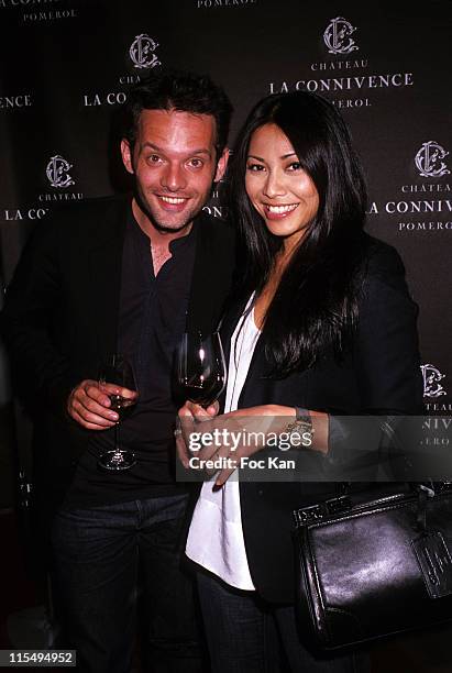 Writer Cyril Montana and singer Anggun attend the Chateau Connivence 2008 Pomerol Wine Launch Cocktail at the Terrasse M6 on June 11, 2009 in Paris,...