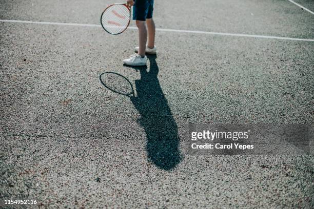 child tennis player shadow - abstract tennis player stock pictures, royalty-free photos & images
