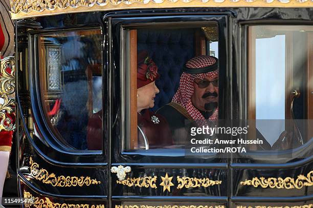 King Abdullah of Saudi Arabia and Queen Elizabeth ll travel in a State Carriage procession along the Mall on October 30, 2007 in London, England.