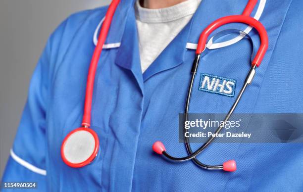 In this studio shot illustration a NHS uniform close up, with stethoscope on June 6,2019 in London,England.