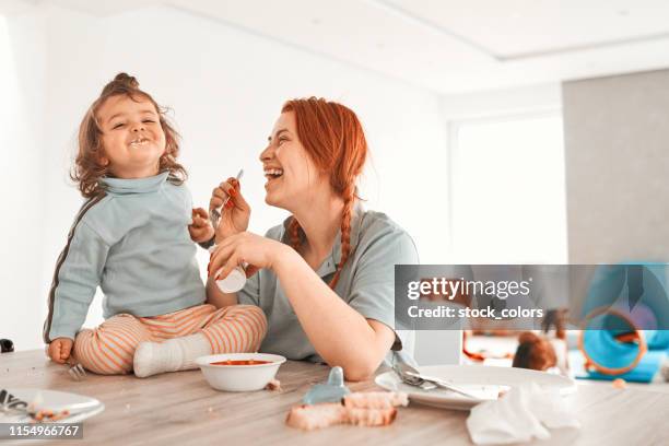 essen und lächeln - yogurt spoon stock-fotos und bilder