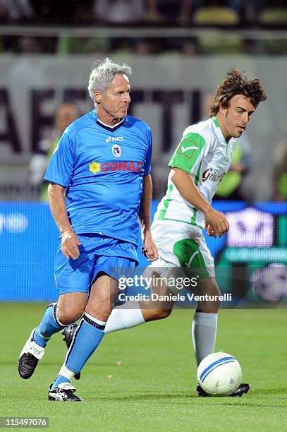 Singer Claudio Baglioni of Nazionale Cantanti and Spanish Ferrari driver Fernando Alonso of Telethon Team in action during the XIX Partita Del Cuore...