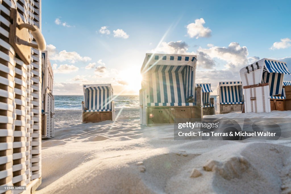 Hooded beach chairs (Strandkörbe) on the beach.