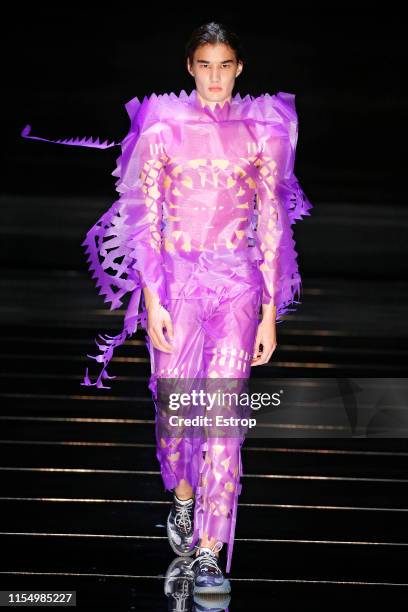 Model walks the runway at the Craig Green fashion show during London Fashion Week Men's June 2019 on June 8, 2019 in London, England.