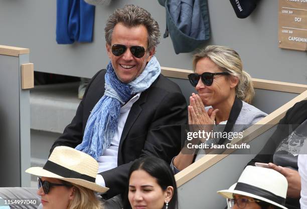 Anne-Sophie Lapix and husband Arthur Sadoun attend the men's final during day 15 of the 2019 French Open at Roland Garros stadium on June 9, 2019 in...