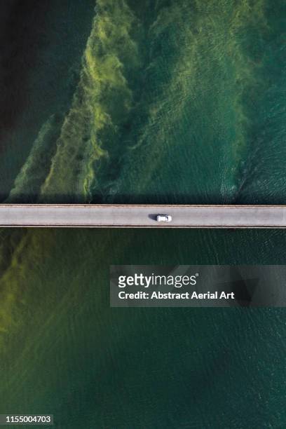 Bridge over unusual water patterns, Iceland