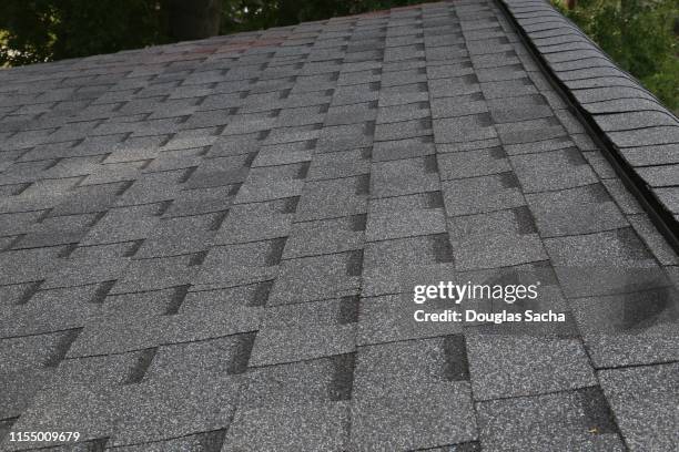 asphalt roof shingles - roof tile stock-fotos und bilder