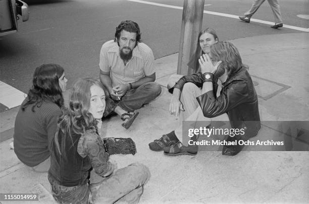 Members of the Manson Family, including Lynette Fromme and Ruth Ann Moorehouse, sitting outside the Los Angeles Hall of Justice during the Charles...