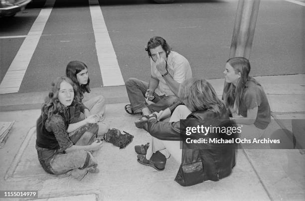 Members of the Manson Family, including Lynette Fromme and Ruth Ann Moorehouse, sitting outside the Los Angeles Hall of Justice during the Charles...