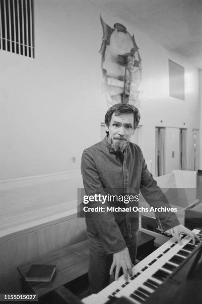 American criminal and cult leader Charles Manson playing the piano inside the chapel at the California Medical Facility, Vacaville, US, circa 1984.