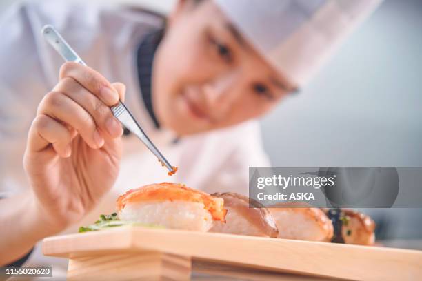 making sushi - sushi chef stock pictures, royalty-free photos & images