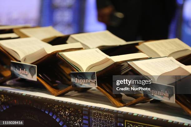 Display showing the holy Quran translated into 70 different languages exhibited during the 43rd Jalsa Salana of the Ahmadiyya Muslim Jama'at Canada...