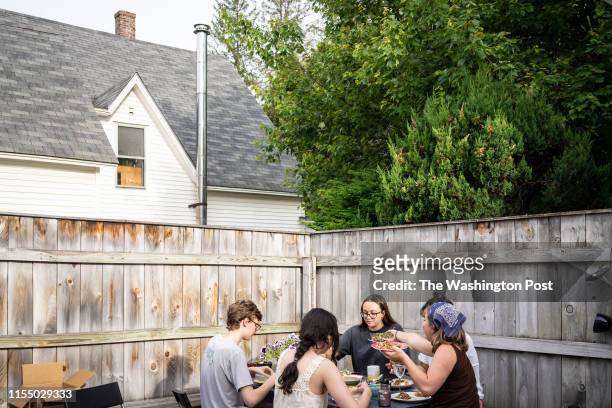 Hanover, NH Maggie Flaherty has dinner with her housemates in their off-campus housing at Dartmouth College in Hanover, New Hampshire, on Wednesday,...