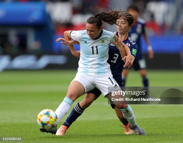 Florencia Bonsegundo of Argentina is challenged by Aya Sameshima of Japan during the 2019 FIFA Women's World Cup France group D match between...