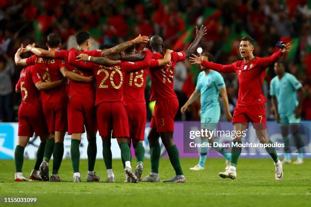 Cristiano Ronaldo of Portugal and his team celebrate the final whistle victory and winning the UEFA Nations League Final between Portugal and the...