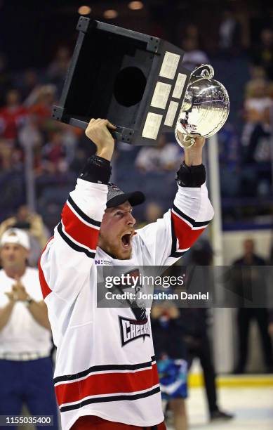 Dan Renouf of the Charlotte Checkers skates with the Calder Cup following game Five of the Calder Cup Finals against the Chicago Wolves at Allstate...