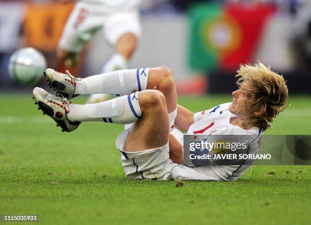 Czech midfielder Pavel Nedved lies on the field after being injured, 01 July 2004 at Dragao stadium in Porto, during the Euro 2004 semi final...