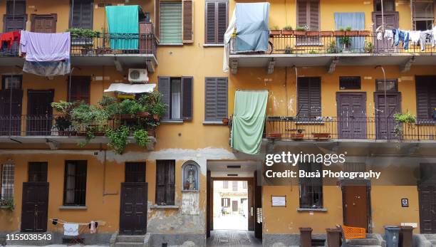 typical housing courtyard in milan, italy - parapetto foto e immagini stock