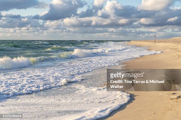 sunset on the beach of sylt. - german north sea region stock pictures, royalty-free photos & images