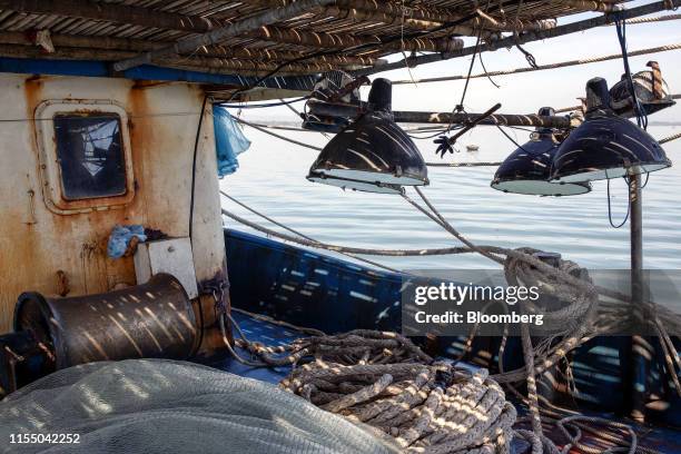 Nets and ropes sit onboard a fishing trawler anchored in Tam Quang harbor in Quang Nam province, Vietnam, on Wednesday, June 26, 2019. Fishermen are...