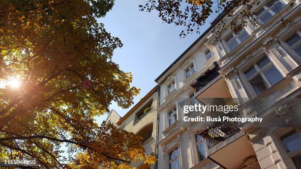 beautiful pre-war residential buildings in the district of kreuzberg, berlin, germany - low angle view street stock-fotos und bilder