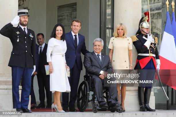 Ecuador's President Lenin Moreno and his wife Rocio Gonzalez , French President Emmanuel Macron and his wife Brigitte Macron pose for a picture after...