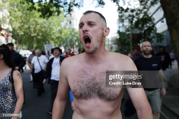 Protester joins a march from the Old Bailey towards Parliament Square after British far-right activist and former leader and founder of English...