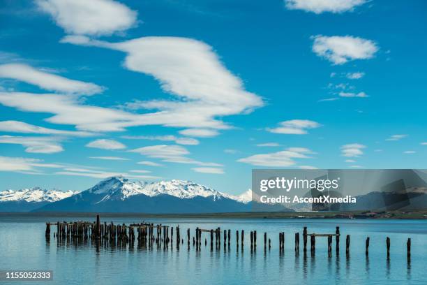 scenic view of lake at puerto natales - puerto natales stock pictures, royalty-free photos & images