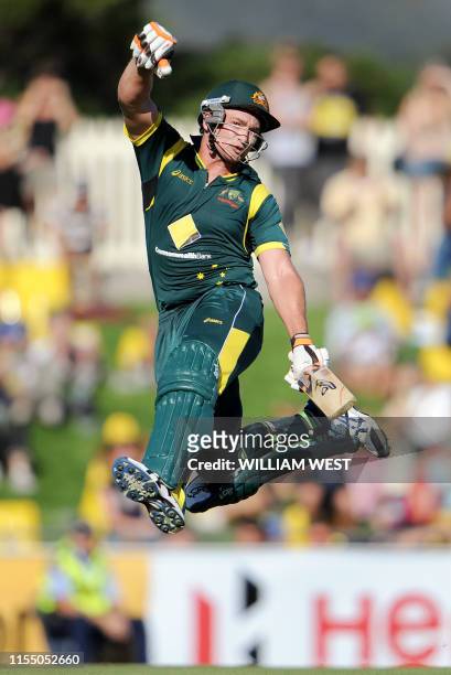 Australian batsman Peter Forrest celebrates scoring his century against Sri Lanka in their international one-day cricket match played in Hobart on...