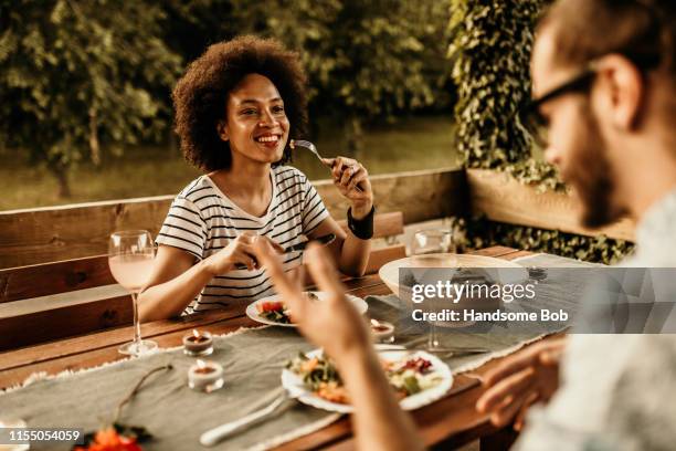 vege - black couple dining stockfoto's en -beelden