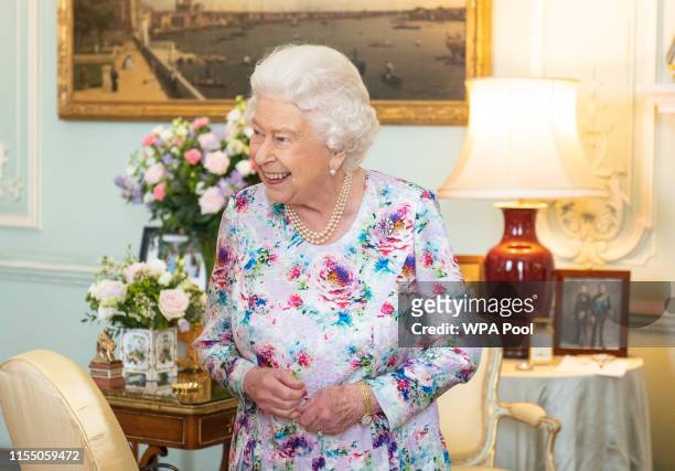 Queen Elizabeth II greets the new Dean of the Chapel Royal Right Reverend Dame Sarah Mullally, and outgoing Dean of the Chapel Royal the Right...