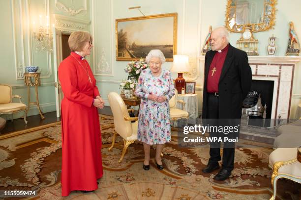 Queen Elizabeth II greets the new Dean of the Chapel Royal Right Reverend Dame Sarah Mullally, and outgoing Dean of the Chapel Royal the Right...