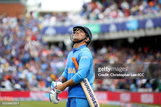 Dhoni of India walks out onto the pitch during the Group Stage match of the ICC Cricket World Cup 2019 between India and Australia at The Oval on...