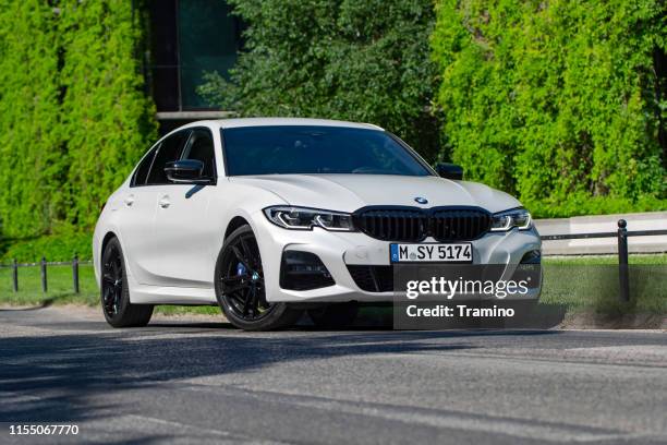 bmw 330i on the street - premium gasoline stock pictures, royalty-free photos & images