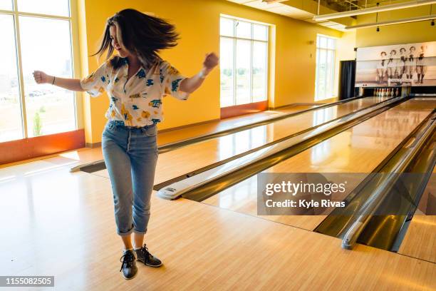 Selena Gomez reacts to getting a strike while participating in bowling at Pinstripes during the Big Slick Celebrity Weekend benefiting Children's...