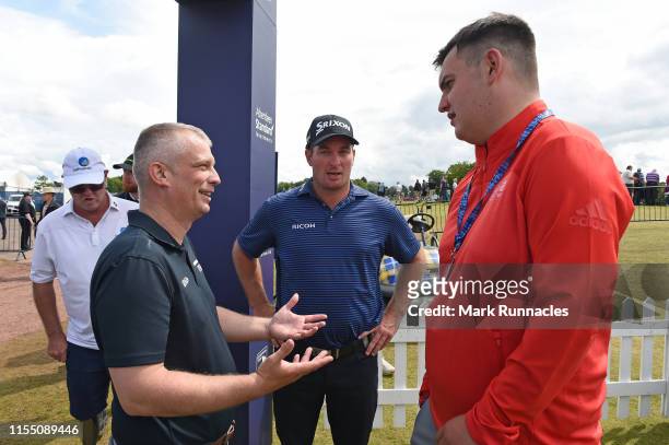 Ryan Fox of New Zealand speaks with EDGA professional golfers at the putting green during Day One of the Aberdeen Standard Investments Scottish Open...