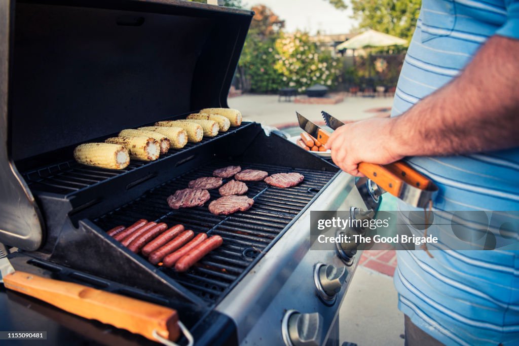 Close up of man grilling