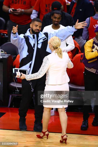 Rapper Drake speaks to TV personality Doris Burke before Game Five between the Toronto Raptors and the Golden State Warriors of the 2019 NBA Finals...