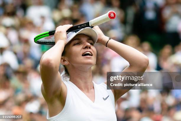 July 2019, Great Britain, London: Tennis: Grand Slam, Wimbledon, women, singles, semi-final: Halep - Svitolina . Simona Halep cheers after her final...