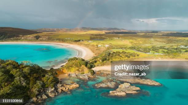 panoramic view of clear water beaches in new zealand. - crescent stock pictures, royalty-free photos & images