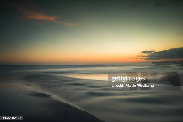 long exposure after sunset at the beach - made widhana stock pictures, royalty-free photos & images