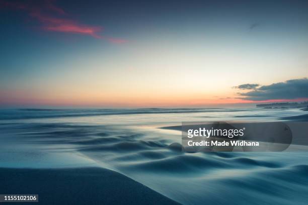 long exposure after sunset at the beach - made widhana stock pictures, royalty-free photos & images