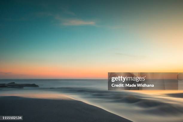 long exposure after sunset at the beach - made widhana stock pictures, royalty-free photos & images