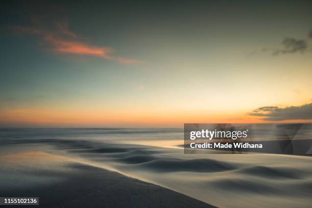 long exposure after sunset at the beach - made widhana stock pictures, royalty-free photos & images