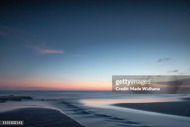 long exposure after sunset at the beach - made widhana stock pictures, royalty-free photos & images