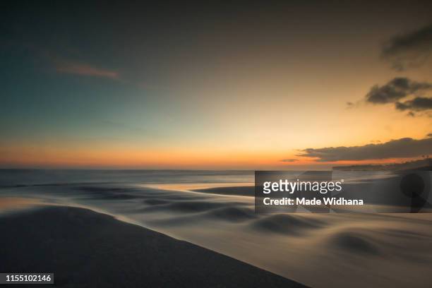 long exposure after sunset at the beach - made widhana stock pictures, royalty-free photos & images