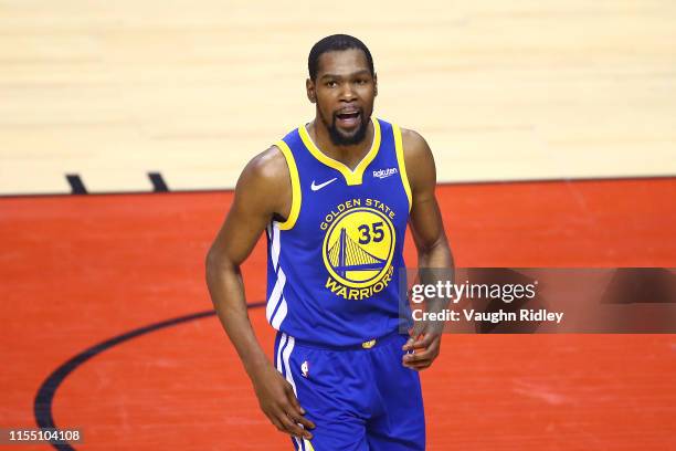 Kevin Durant of the Golden State Warriors reacts against the Toronto Raptors in the first half during Game Five of the 2019 NBA Finals at Scotiabank...