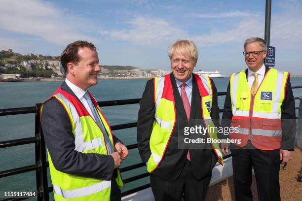 Boris Johnson, former U.K. Foreign secretary, center, speaks with Charlie Elphicke, U.K. Lawmaker, left, and Doug Bannister, chief executive officer...