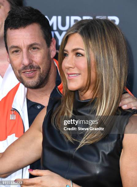 Adam Sandler and Jennifer Aniston arrives at the LA Premiere Of Netflix's "Murder Mystery" at Regency Village Theatre on June 10, 2019 in Westwood,...