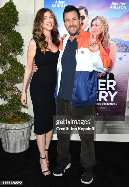 Adam Sandler and Jackie Sandler attend LA Premiere Of Netflix's "Murder Mystery" at Regency Village Theatre on June 10, 2019 in Westwood, California.
